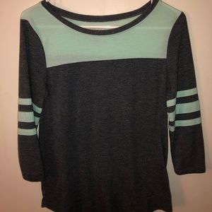 teal and dark grey shirt